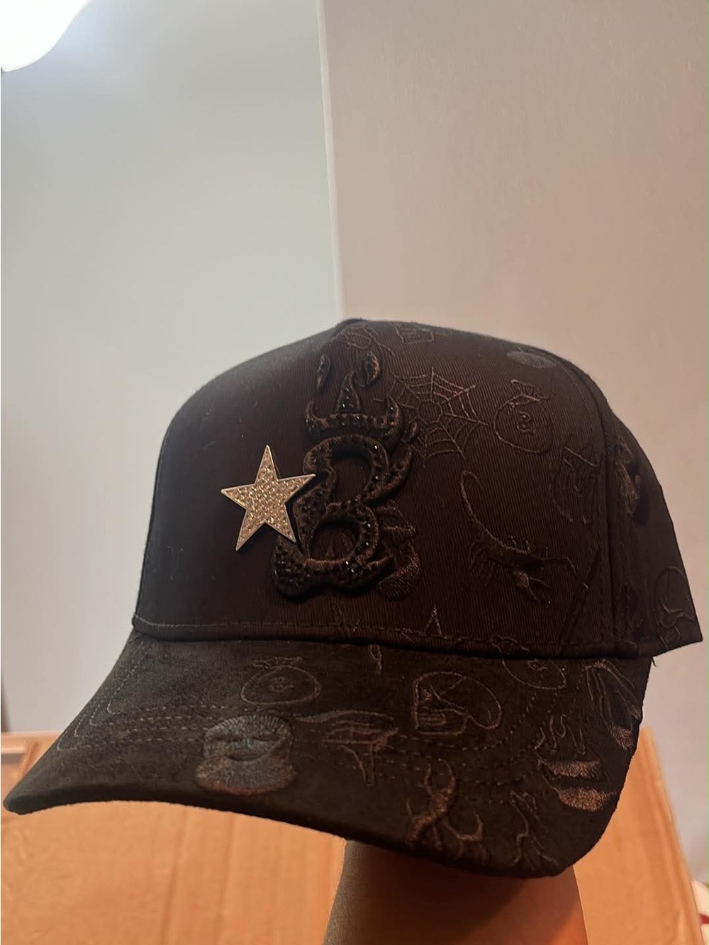 Black Embroidered Cap with Star Accent